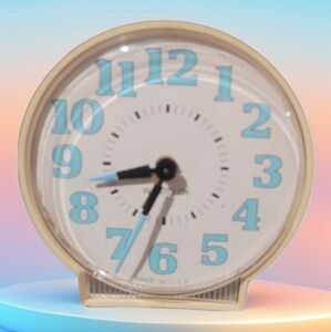Westclox MCM Cream and Blue Glow in The Dark Wind Up Travel Alarm Clock